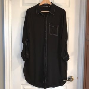 Sheer black button up tunic with contrast stitching and roll-up sleeves
